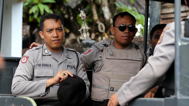 Police officers at the Bali Parole office in Denpasar ahead of Schapelle’s final check in tonight. Picture: Nathan Edwards.