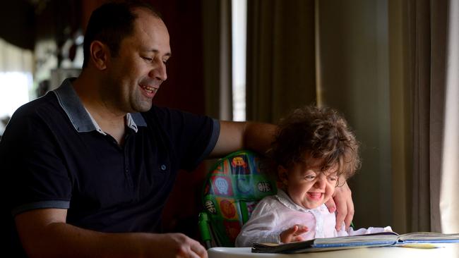 Ivica and Julija look at books. Picture: Tricia Watkinson