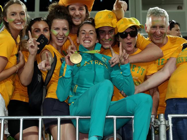 Alicia Quirk celebrates with fans and her gold medal. Picture: Adam Head