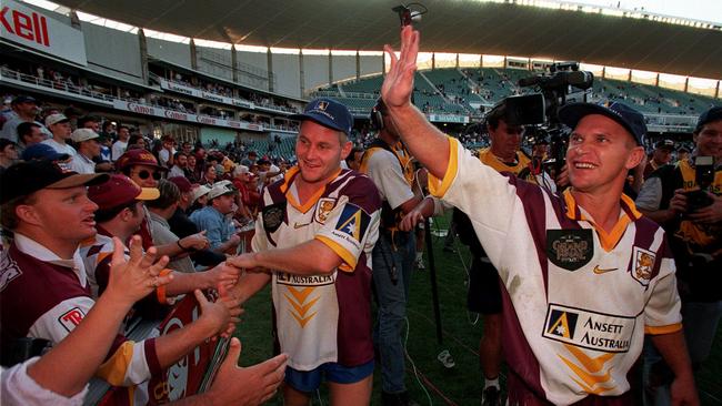 Broncos players celebrate their win in the 1998 grand final. Picture: Mark Evans