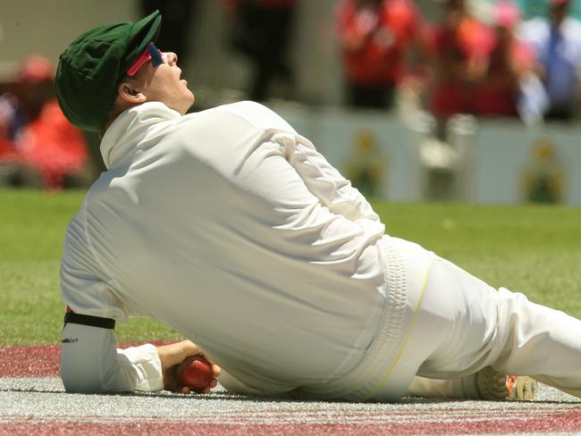 Steve Smith looks up towards spidercam after he dropped a catch. Pic Mark Evans