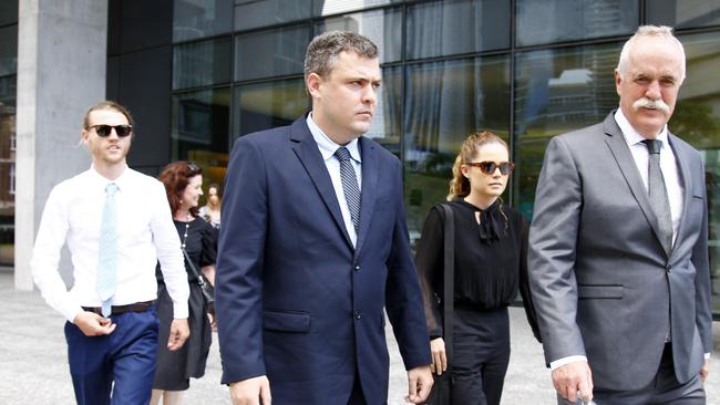 Family members and supporters flank Nolan (centre in blue suit) as he leaves the courthouse. He will be sentenced next week. Picture: NCA NewsWire/Tertius Pickard