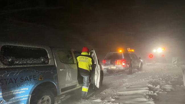 Hobart City Council workers brave think snow and blizzard conditions on their way to rescue walkers stranded on kunanyi/Mt Wellington. Picture: City of Hobart