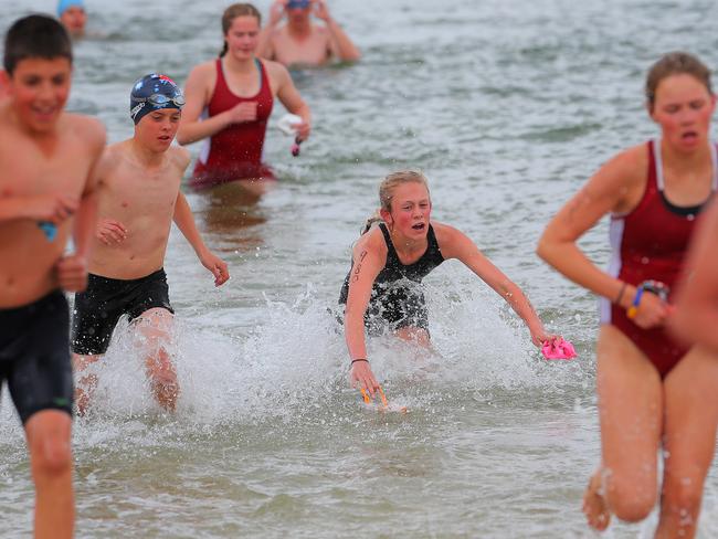 Ebony Webb, from Calvin Christian, has a tumble in the water but eventually went on to win the girls individual grade 8 section.