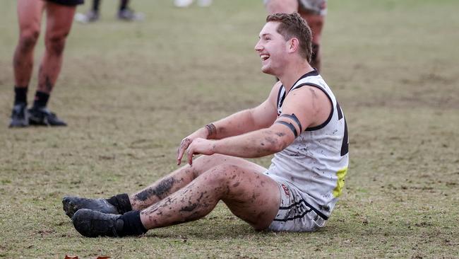 EDFL: Roxburgh Park’s Jake Talintyre slips over as he kicks a goal. Picture: George Sal