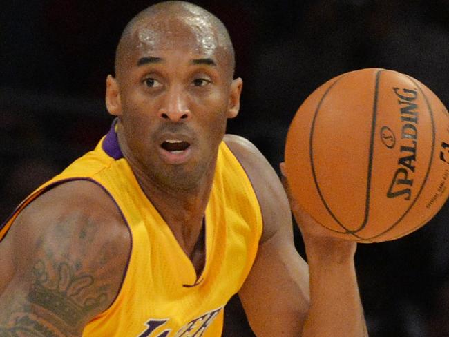 Kobe Bryant of the Los Angeles Lakers drives against the Memphis Grizzlies during their NBA game 33 at the Staples Center in Los Angeles, California on January 2, 2014. The Grizzlies went on to win 109-106. AFP PHOTO/MARK RALSTON