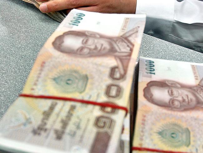 Thailand’s treasury has announced new banknotes featuring the King Maha Vajiralongkorn, but most baht notes feature his late father, King Bhumibol Adulyadej Mahidol. Picture: AP