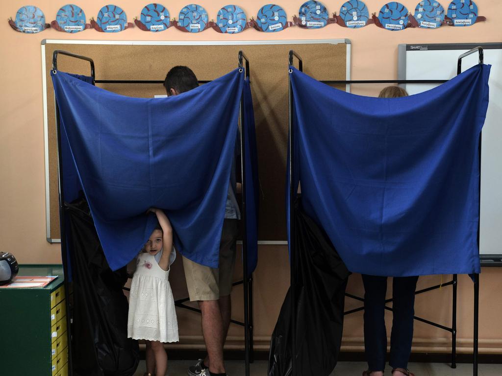 People cast their vote at the polling booth at a polling station in Thessaloniki, Greece. Picture: AFP