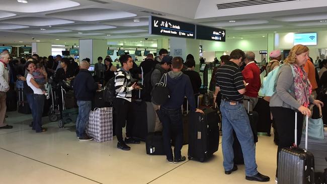 Chaos at Sydney Airport International Check-in after a passport processing system malfunction has brought Australian Airports to their knees. Picture: Clarissa Bye