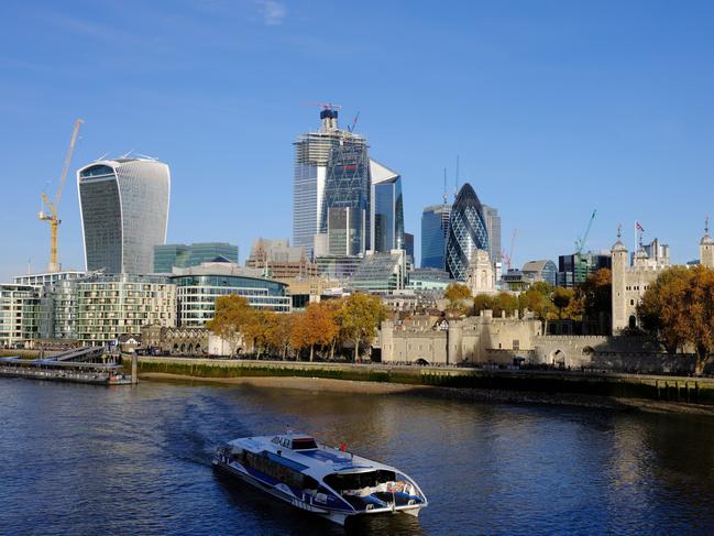 The Tower of London, right, and Skyscrapers, including 20 Fenchurch Street, also known as the "Walkie-Talkie," 22 Bishopsgate office tower, the Leadenhall building, also known as the "Cheesegrater", The Scalpel and 30 St Mary Axe, also known as "the Gherkin" stand beside the River Thames in the City of London, U.K., on Wednesday, Nov. 14, 2018. The City of London averted one disaster with the draft Brexit deal announced Wednesday, but the bottom line is that banks, brokers and asset managers will continue to prepare for the talks going off the rails. Photographer: Bryn Colton/Bloomberg