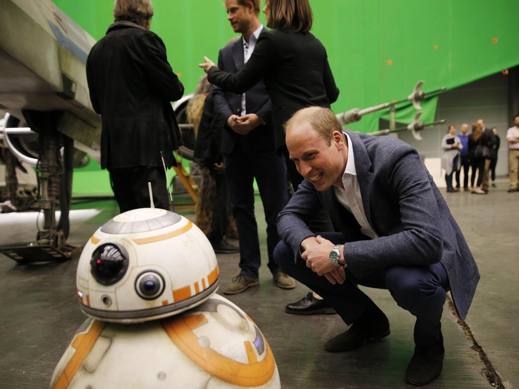 Prince William, Duke of Cambridge smiles at the BB-8 droid during a tour of the Star Wars sets at Pinewood studios on April 19, 2016 in Iver Heath, England. Picture: Getty