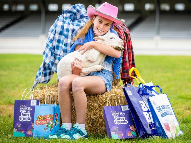 Billie, 11, pictured with Barbara the lamb, was the face of the 2023 Show. Picture: Jake Nowakowski