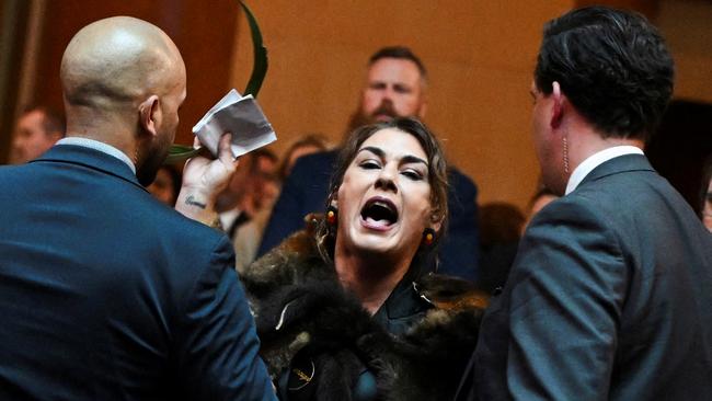 Australian Senator Lidia Thorpe stages a protest as Britain's King Charles and Queen Camilla attend a Parliamentary reception in Canberra, Australia - 21 Oct 2024. Victoria Jones/Pool via REUTERS TPX IMAGES OF THE DAY