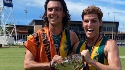 Teammates Connor McDonald and Harry Maher after winning the NTFL Grand Final. Picture: Supplied