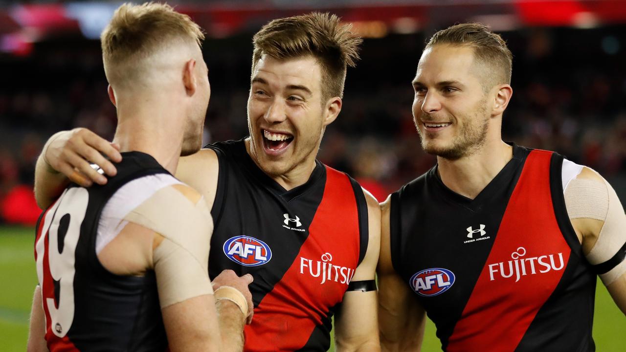 Zach Merrett, pictured with teammates Nick Hind and David Zaharakis, says Ben Rutten is the biggest factor in his decision to stay. Picture: Michael Willson/AFL Photos