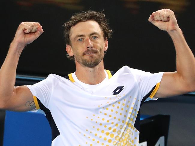 MELBOURNE, AUSTRALIA - JANUARY 17: John Millman of Australia celebrates after winning his first round singles match against Feliciano Lopez of Spain during day one of the 2022 Australian Open at Melbourne Park on January 17, 2022 in Melbourne, Australia. (Photo by Kelly Defina/Getty Images)