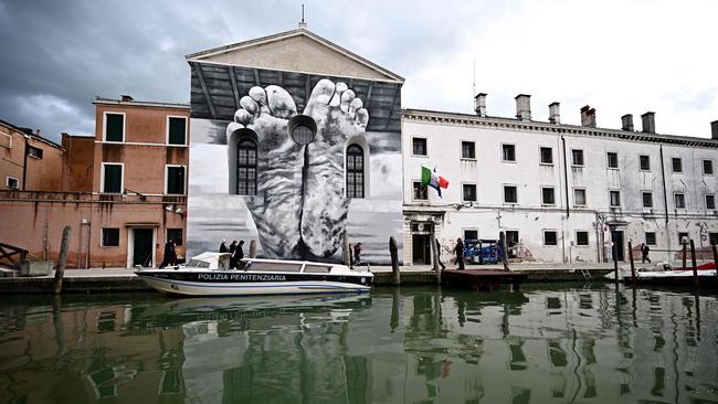 The Venice Biennale, which featured a mural by Maurizio Cattelan outside Giudecca Women’s Prison in April 2024. Picture: AFP