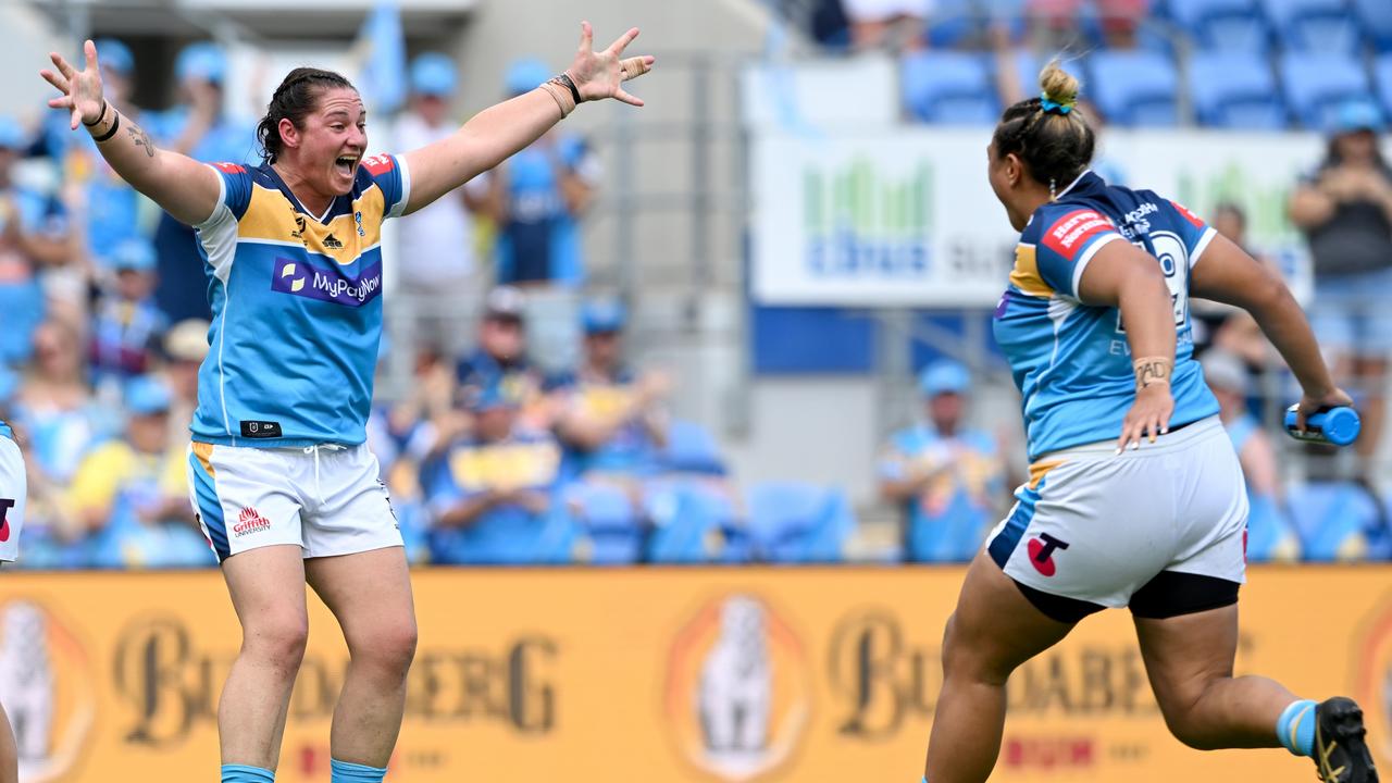 Steph Hancock and April Ngatupuna celebrate the Titans’ win against the Broncos. Picture: Bradley Kanaris/Getty Images