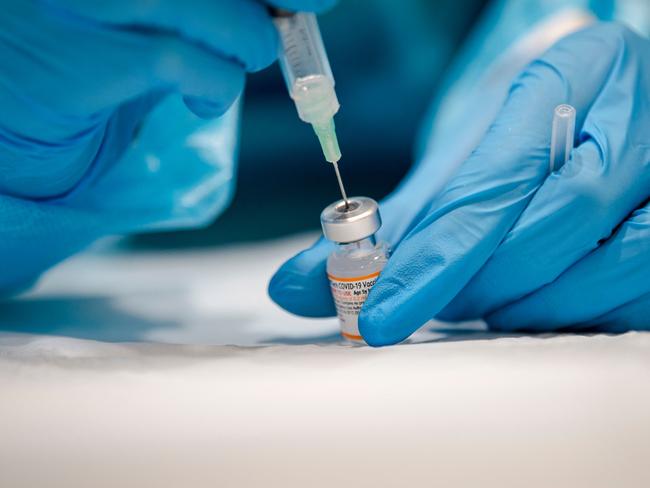 A nurse prepares a dose of the Pfizer vaccine in Quebec. Picture: Andrej Ivanov/AFP