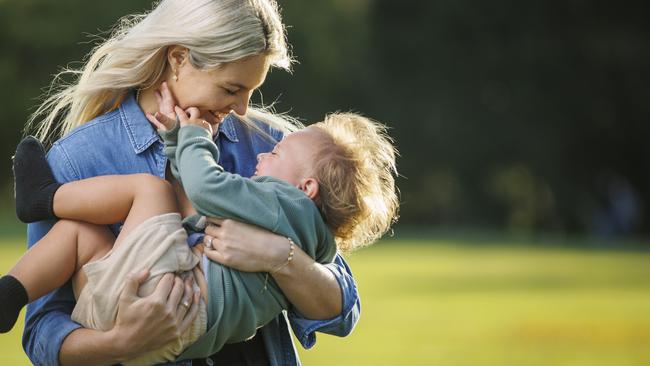 Firebirds star Gretel Bueta pictured with son Bobby, 21 months, is expecting her second child. Picture Lachie Millard