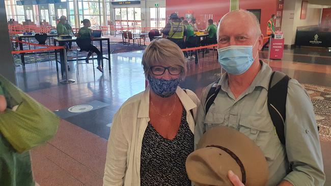 Kerri Buckley and Geoff Browning arrived back in Alice Springs from a flight from Sydney.