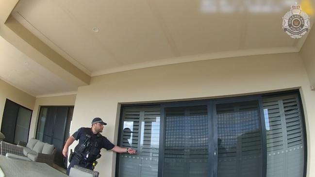 Police knocking on the back door of the Benowa home. Picture: QLD Police