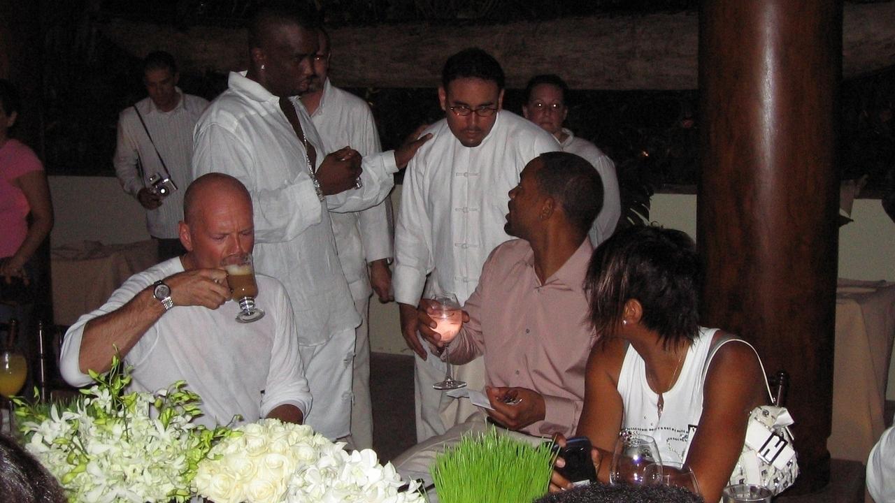 Actors Bruce Willis (seated, left) and Will Smith (right) at the 2004 bash. Picture: BACKGRID