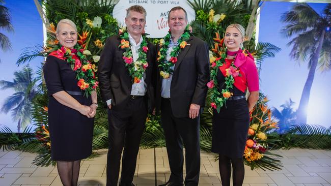 Qantas cabin crew Kimmy Jones and Lauren Clarkson, with Qantas International CEO Cam Wallace and Brisbane Airport Corporation CEO Gert-Jan de Graaff.