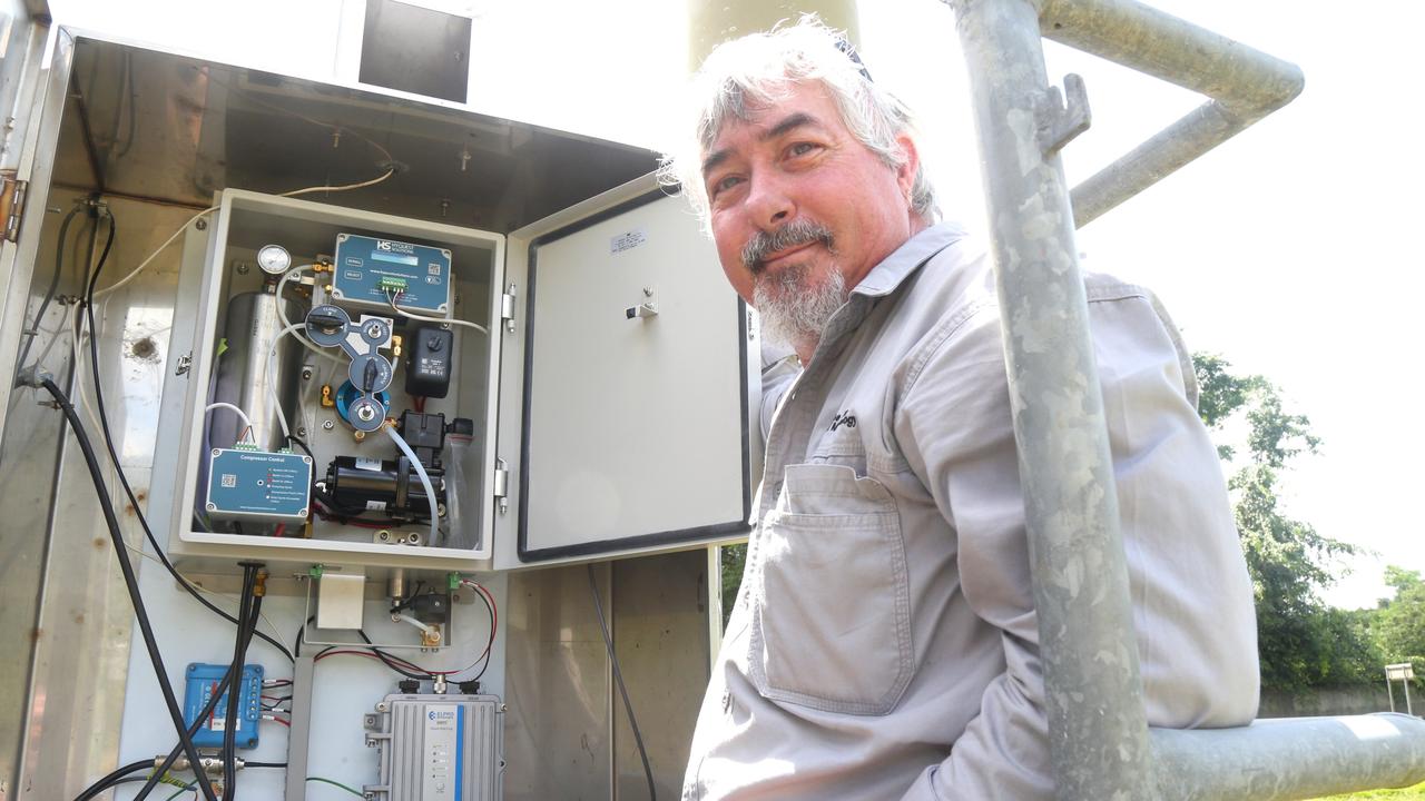 Bureau of Meteorology technician Alex Hoy attached to the Observing Operations Hub Cairns at the refitted Barron River flood height monitoring station in Kamerunga. Picture: Peter Carruthers