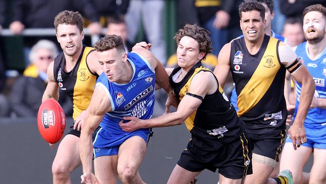 Broadview captain Jay O’Leary applies tackle pressure in the grand final against SHOC as Petrenko and Gotch watch on. Picture: Tom Huntley