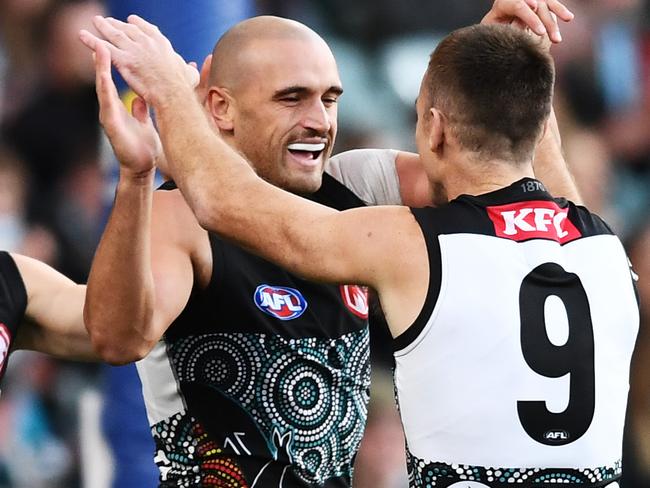 ADELAIDE, AUSTRALIA - MAY 30: Sam Powell-Pepper of Port Adelaide celebrates a goal and hugs Robbie Gray of Port Adelaide during the round 11 AFL match between the Port Adelaide Power and the Fremantle Dockers at Adelaide Oval on May 30, 2021 in Adelaide, Australia. (Photo by Mark Brake/Getty Images)