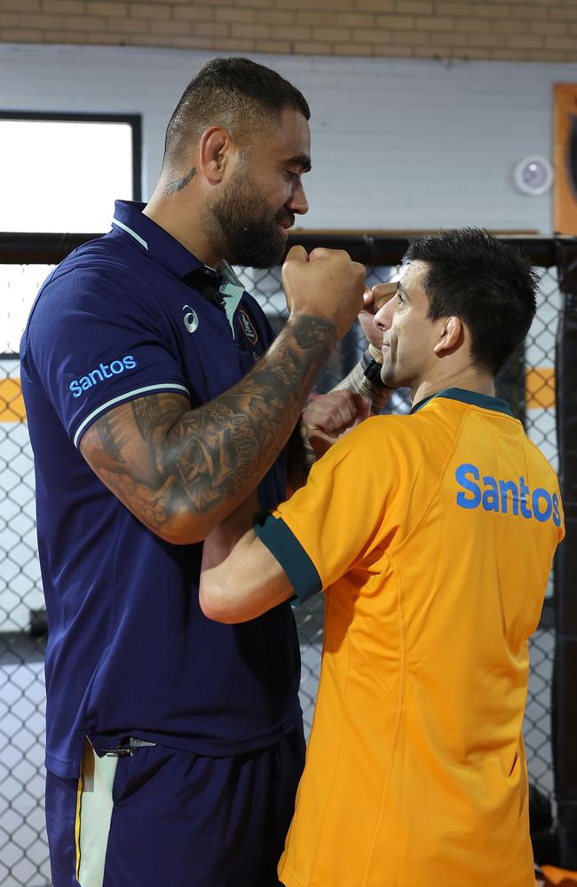 Wallabies star Lukhan Salakaia-Loto and UFC fighter Steve Erceg face off during a joint Wallabies and UFC media opportunity last year. Picture: Getty Images