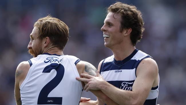 GEELONG, AUSTRALIA - APRIL 14: Max Holmes of the Cats celebrates a goal during the round five AFL match between Geelong Cats and North Melbourne Kangaroos at GMHBA Stadium, on April 14, 2024, in Geelong, Australia. (Photo by Darrian Traynor/Getty Images)