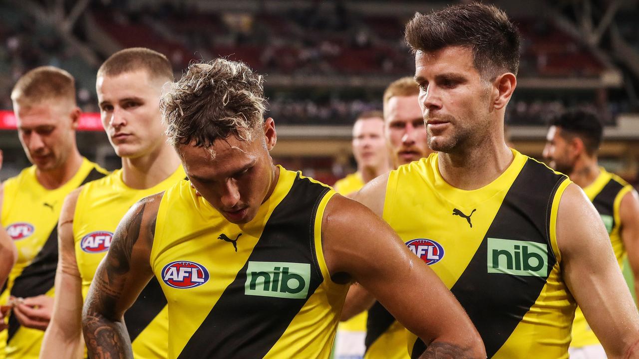 Trent Cotchin, right, has been fined for kicking Crow Taylor Walker. Picture: Sarah Reed/AFL Photos