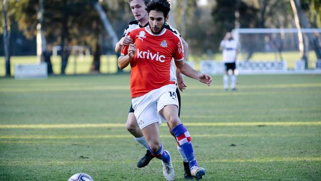 Oliver Zafiridis in action for Raiders, who have backed a proposal to slash player and coach wages across the state’s top-three soccer competitions. Picture: AAP Image/ Morgan Sette