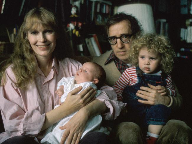 Mia Farrow holding son Satchel, now known as Ronan, with father, Woody Allen holding daughter Dylan. Picture: Getty Images