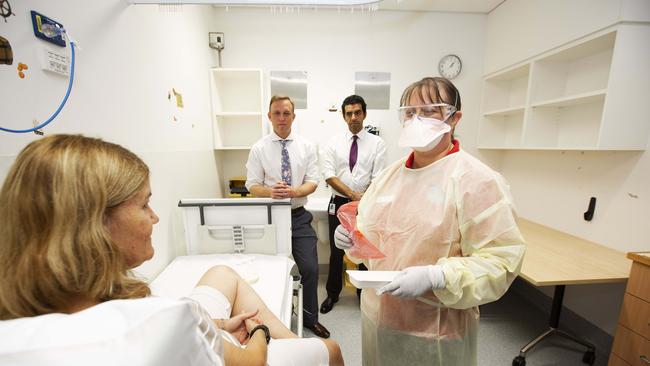 Janice Geary (clinical nurse consultant, Infection Management Service) demonstrating patient check for Covid-19 coronavirus. Fever Clinic at The Prince Charles Hospital, Rode Rd, Chermside, Brisbane, 6th of March 2020. (AAP Image/Attila Csaszar)