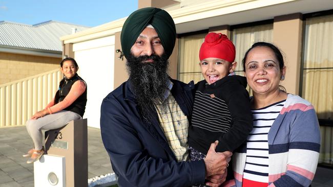 Gurpreet and Gagandeer Sidhu, with children Harnoor, 11, and Birfateh, 4, at Canning Vale, Perth, yesterday. Picture: Colin Murty