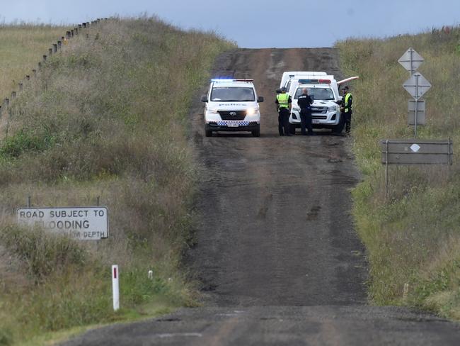 Police cordon off Brimblecombe Rd, Kingsthorpe, near where a man and multiple dogs were killed in floodwaters early on Monday morning.