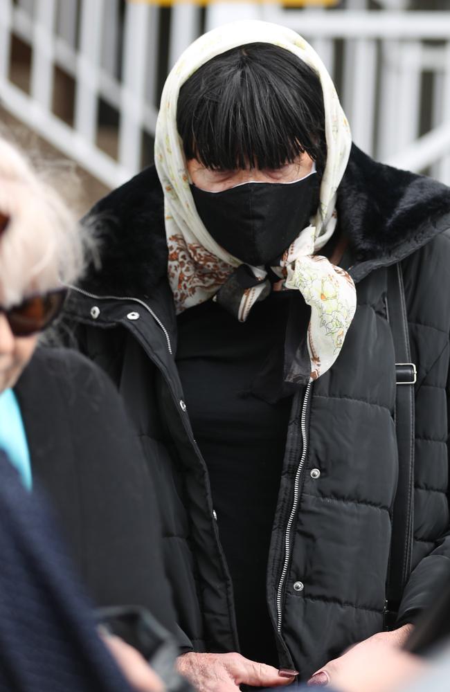 Reginald/ Regina Arthurell is removed from his Yagoona unit by a community corrections officer. picture John Grainger