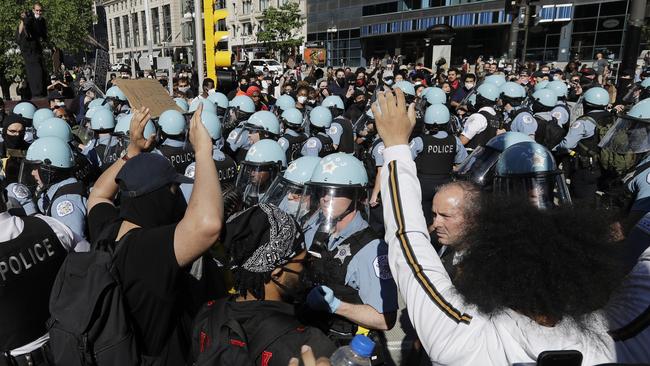 Chicago Police hold back protesters on Saturday.