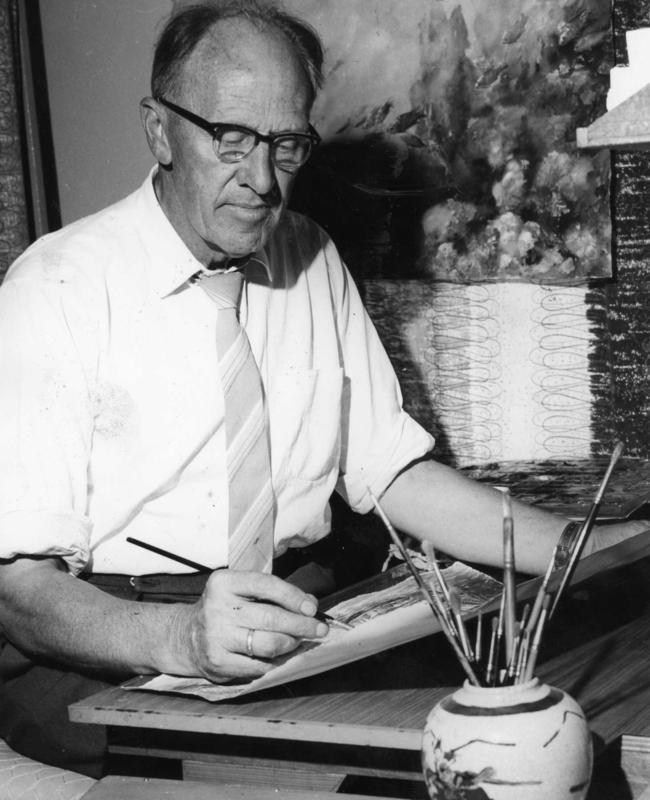 The artist painting in his studio in the 1950s.