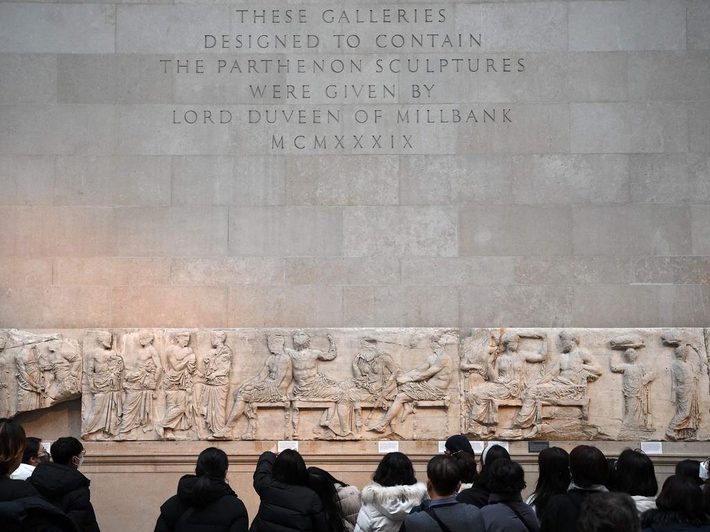 Visitors view the Parthenon Marbles, also known as the Elgin Marbles, at the British Museum in London. Picture: Daniel Leal / AFP
