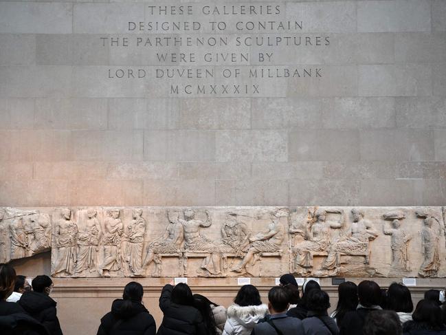 Visitors view the Parthenon Marbles, also known as the Elgin Marbles, at the British Museum in London. Picture: Daniel Leal / AFP