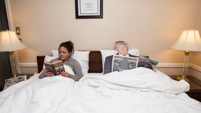Bedtime stories: Gabrielle Fonrouge and Fake Trump catches up their reading. It’s unknown if Trump is reading “fake news”. Picture: Annie Wermeil/NY Post
