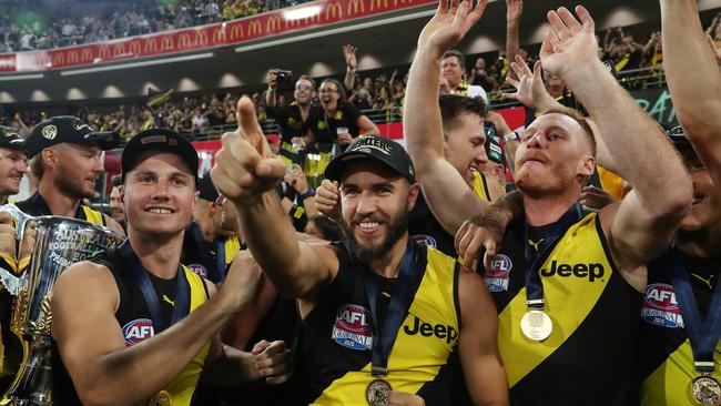 Shane Edwards celebrates a third AFL premiership. Picture: Sarah Reed.