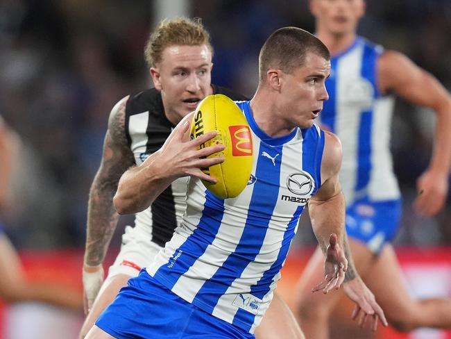 MELBOURNE, AUSTRALIA - JUNE 16: Bailey Scott of the Kangaroos runs with the ball during the round 14 AFL match between North Melbourne Kangaroos and Collingwood Magpies at Marvel Stadium, on June 16, 2024, in Melbourne, Australia. (Photo by Daniel Pockett/Getty Images)