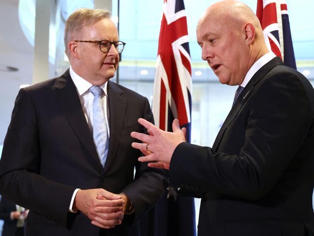 Australia's Prime Minister Anthony Albanese (L) talks with New Zealand's Prime Minister Christopher Luxon in Sydney on December 20, 2023. (Photo by DAVID GRAY / AFP)