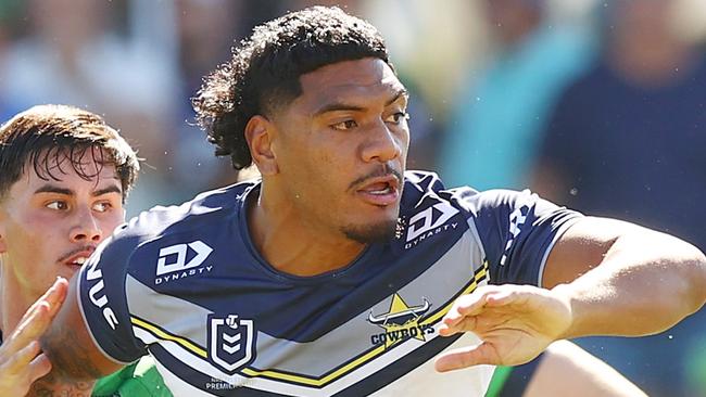 QUEANBEYAN, AUSTRALIA - FEBRUARY 25: Thomas Mikaele of the Cowboys offloads during the NRL Pre-season challenge match between Canberra Raiders and North Queensland Cowboys at Seiffert Oval on February 25, 2024 in Queanbeyan, Australia. (Photo by Mark Nolan/Getty Images)