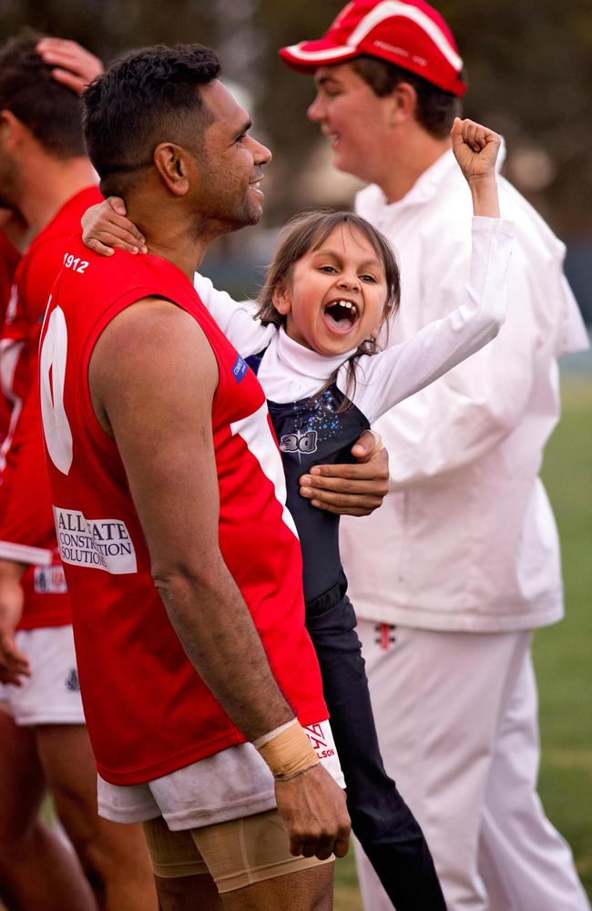 South Augusta Football Club’s Kriston Thompson celebrates with daughter Krista, 7, after his team defeated Solomontown in Port Augusta. Picture: Magic Memories by Erika